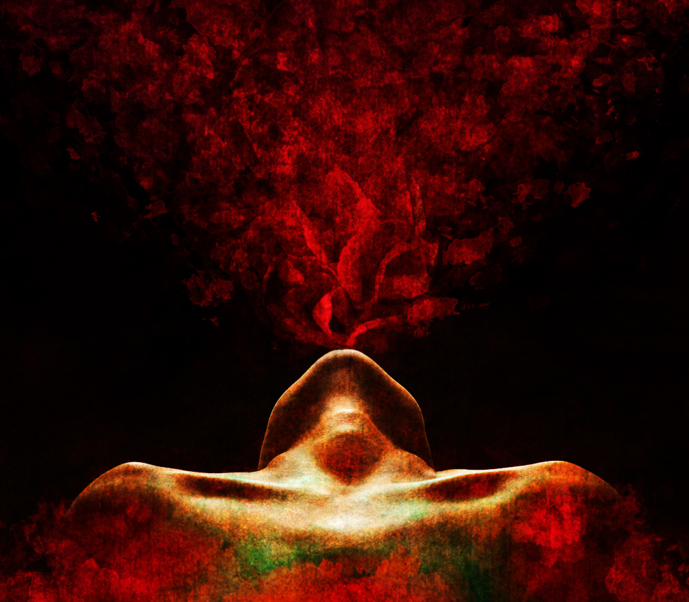 A woman lies on his back, exhaling red smoke from his mouth against a dark background.